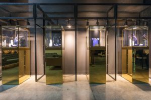 Golden jewelry display stands at Chaumet event by Loesje Kessels Fashion Photographer Dubai