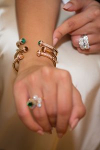 Guest trying on 3 new bracelets at the Piaget event by Loesje Kessels Fashion Photographer Dubai